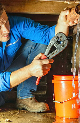 Plumber Tightening Pipe
